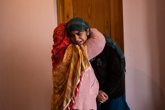 <p>Teenage daughter of Mohammad Altaf Bhat weeps after her father was killed in Srinagar on 15 November by security forces along with three others</p>