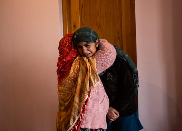 <p>Teenage daughter of Mohammad Altaf Bhat weeps after her father was killed in Srinagar on 15 November by security forces along with three others</p>