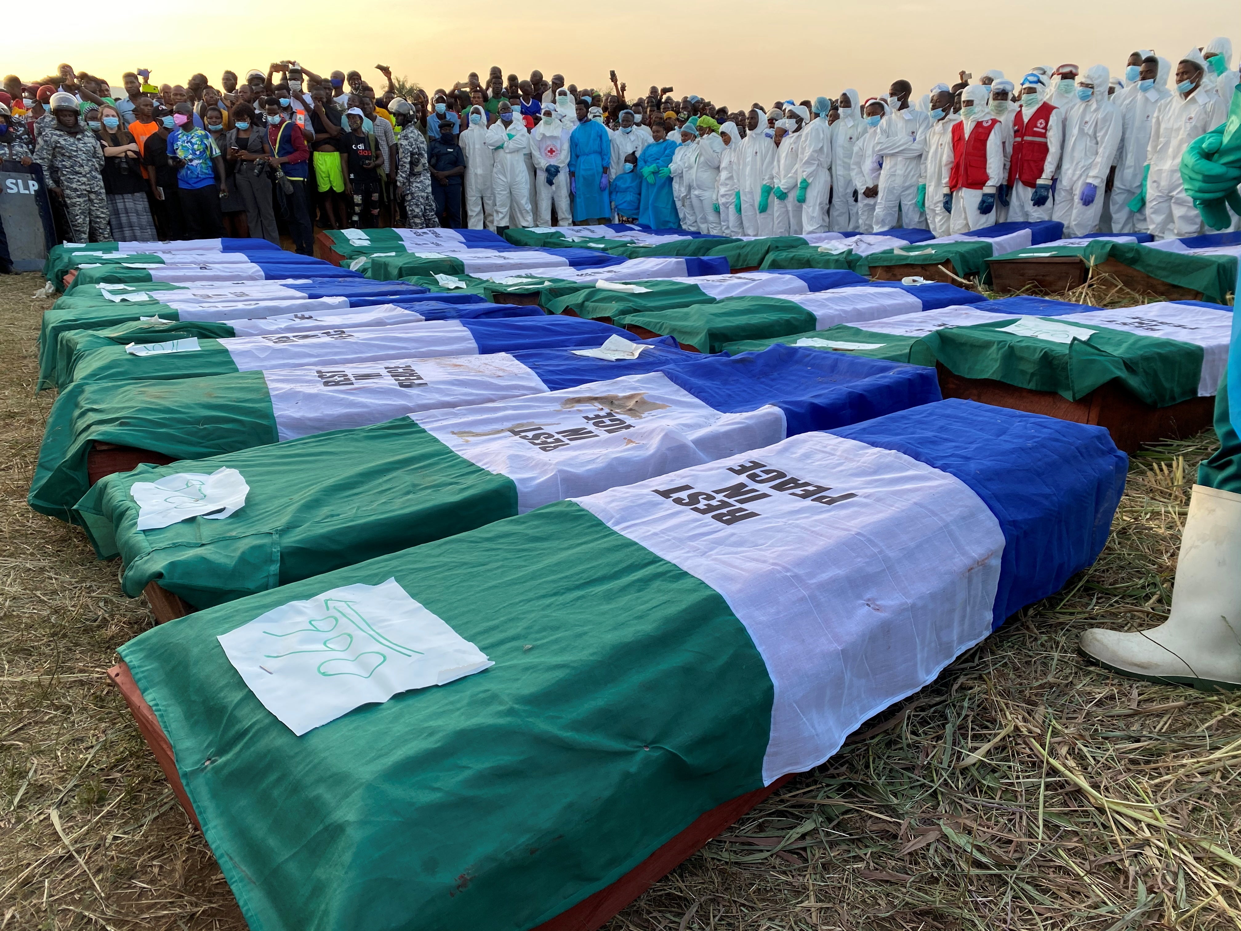 Mourners at a mass burial ceremony for the disaster victims