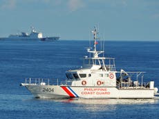 Chinese vessels fire on Philippines supply ships with water cannon in South China Sea clash