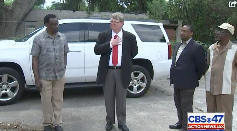 Kevin Gough surrounded by members of the Brunswick NAACP chapter after he was fired as Brunswick Judicial Circuit public defender in 2016