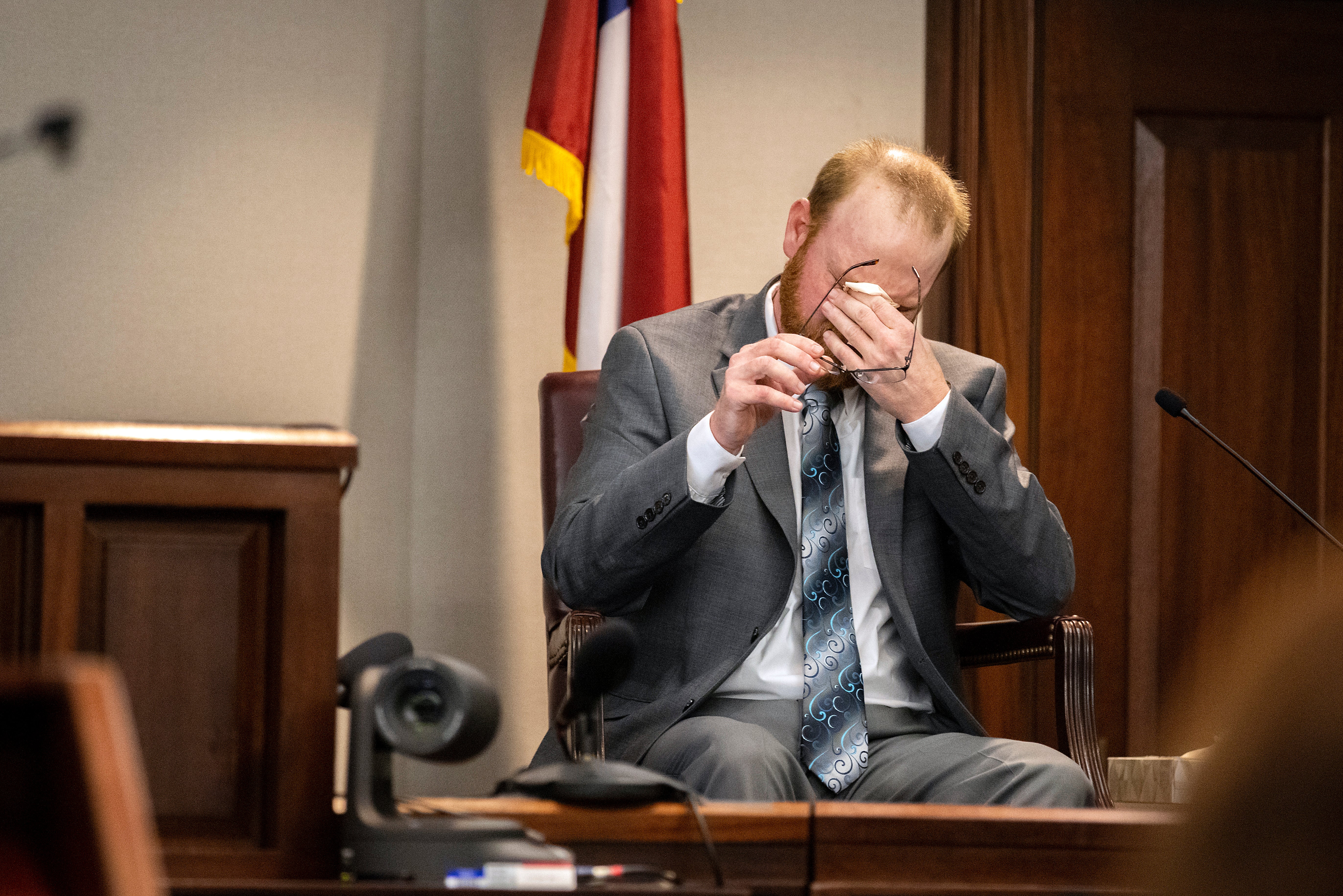 Travis McMichael wipes away tears as he testified how he shot dead Ahmaud Arbery in court on Wednesday