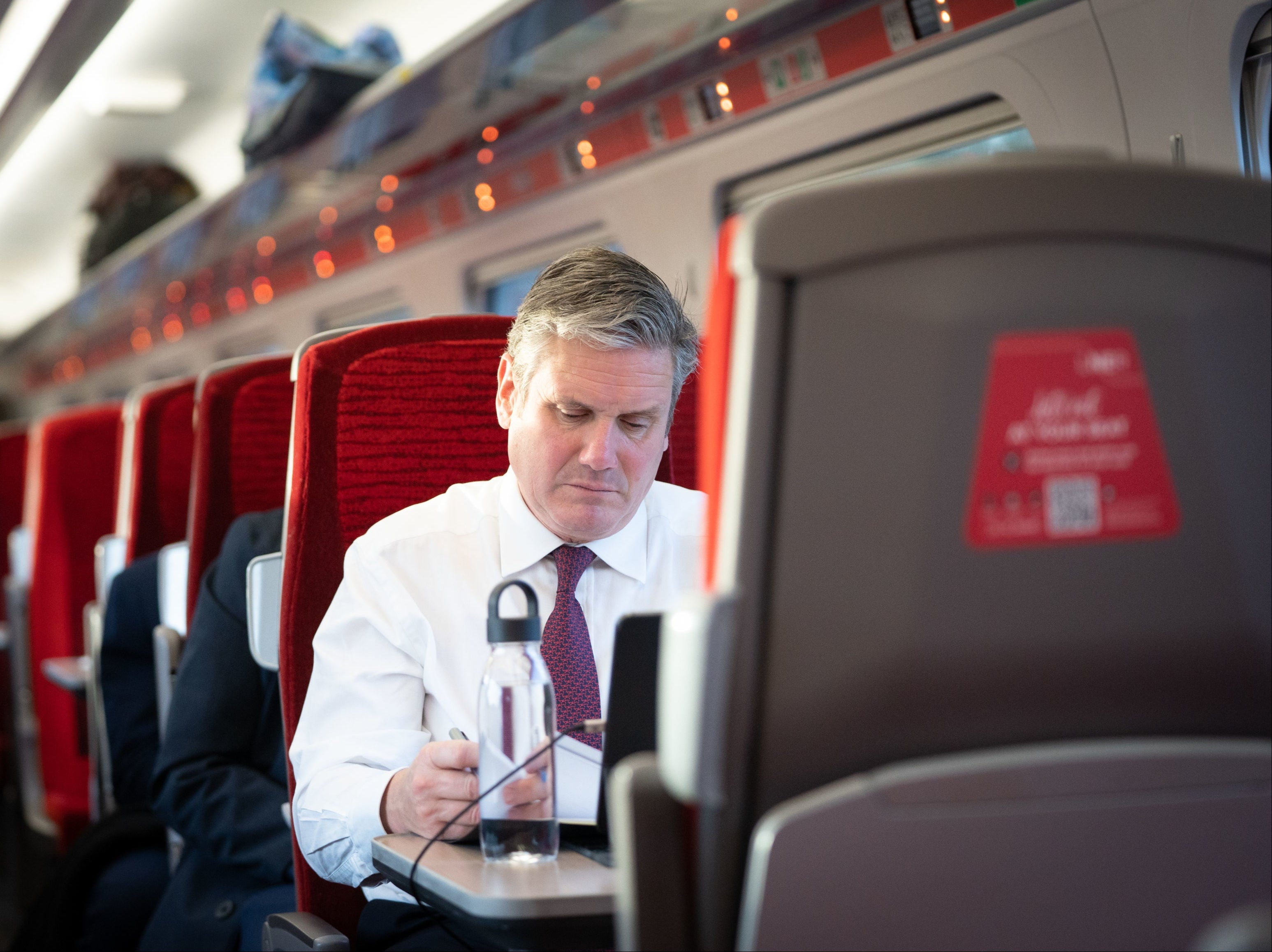 Keir Starmer, on a train, probably reading Labour’s last manifesto