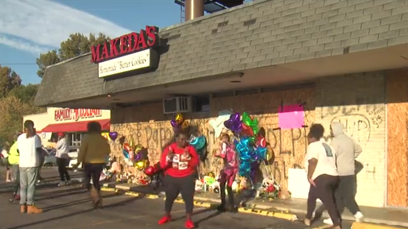 Footage at a small memorial for the rapper outside the shop where he was killed shows startled mourners scrambling for cover after the shot was fired