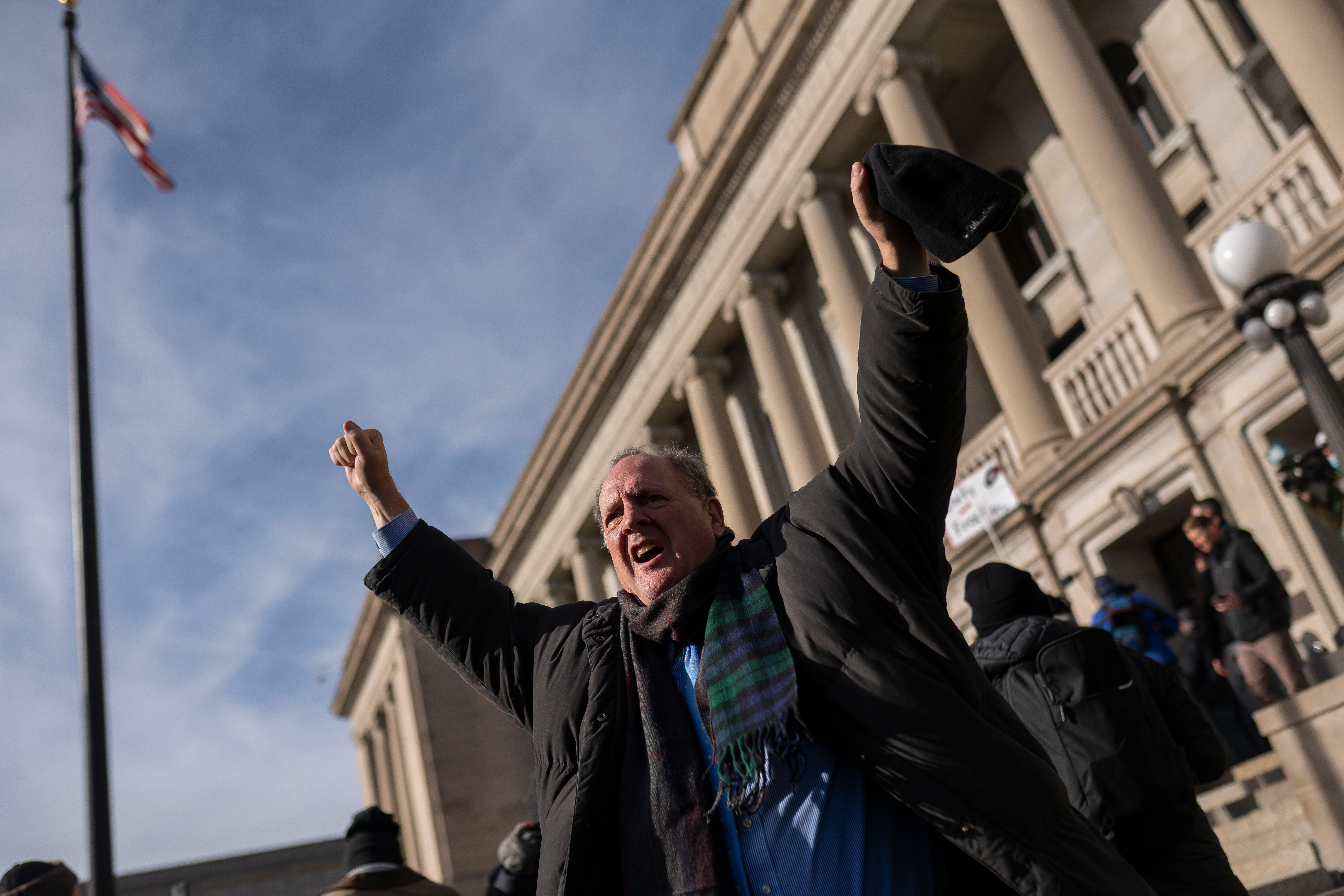 A supporter of Kyle Rittenhouse reacts as a not guilty verdict is read in front of the Kenosha County Courthouse on November 19, 2021 in Kenosha, Wisconsin