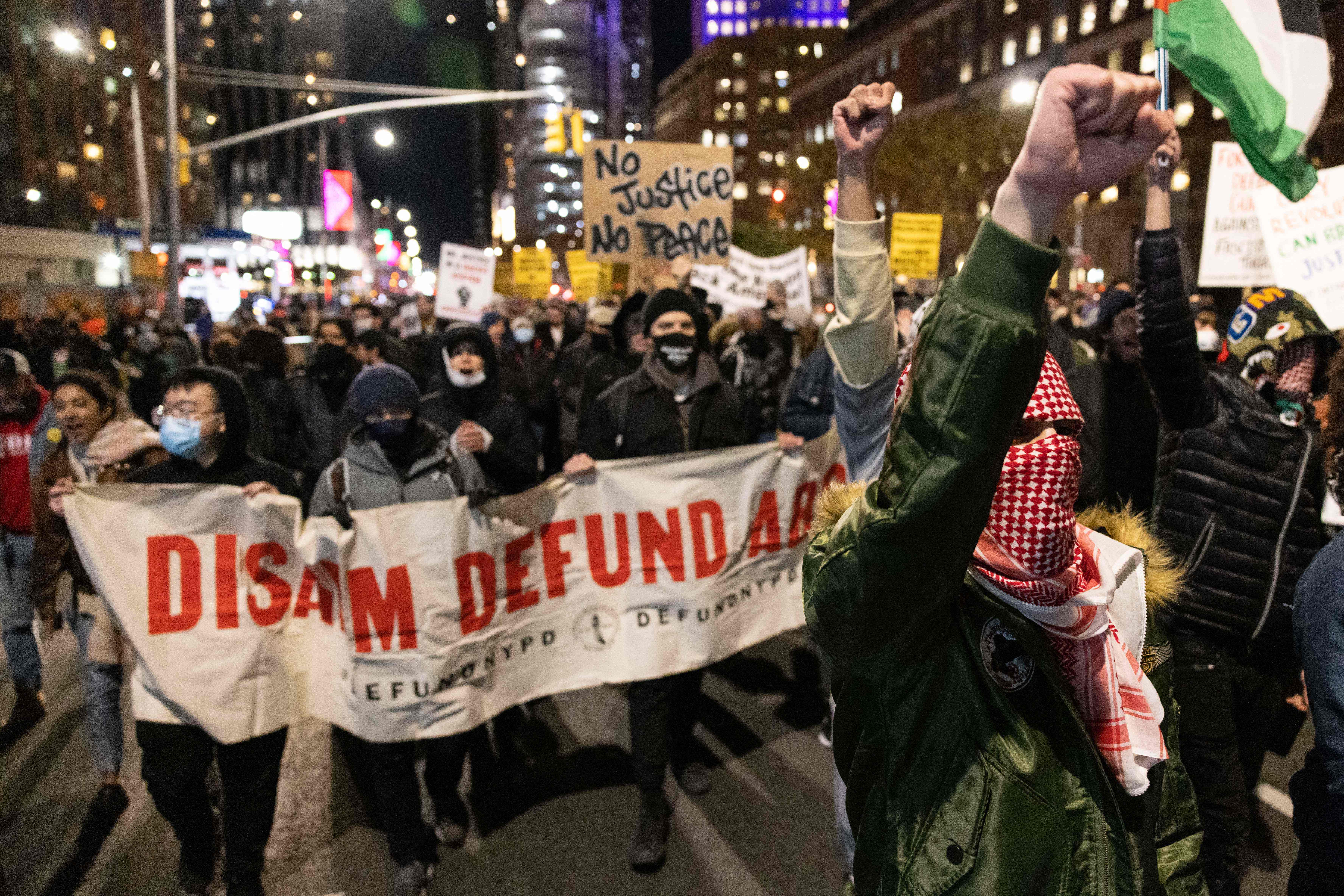 Demonstrators march in Brooklyn, New York following the verdict in the Kyle Rittenhouse trial