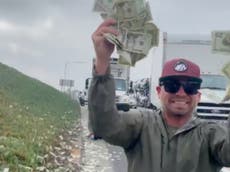 Drivers scramble to grab cash that fell from armoured truck on California freeway