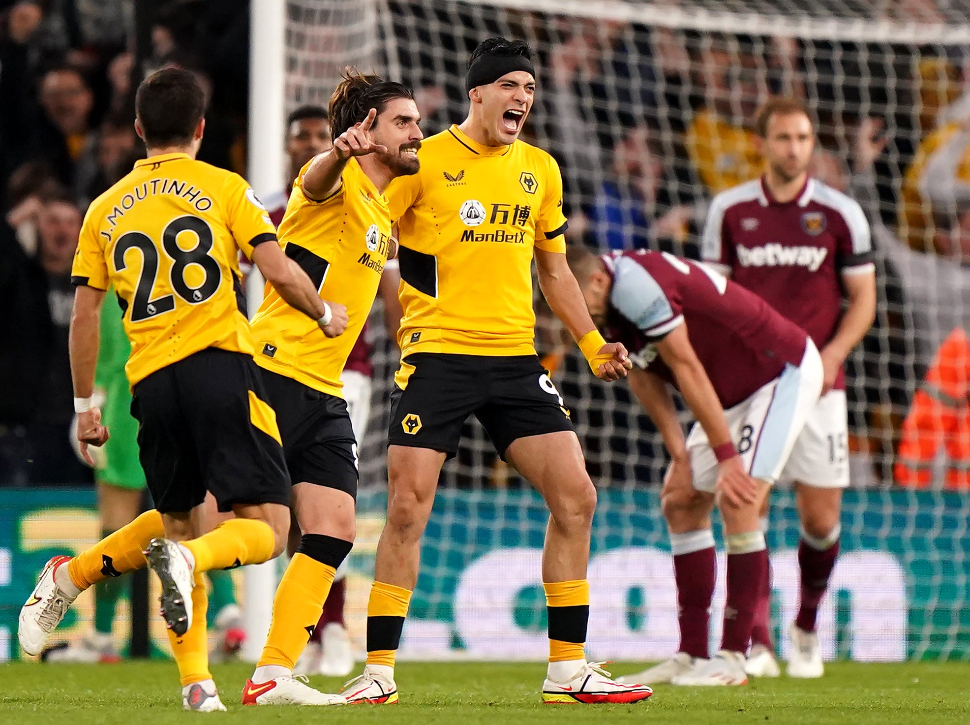 Raul Jimenez (right) celebrates scoring Wolves’ winner