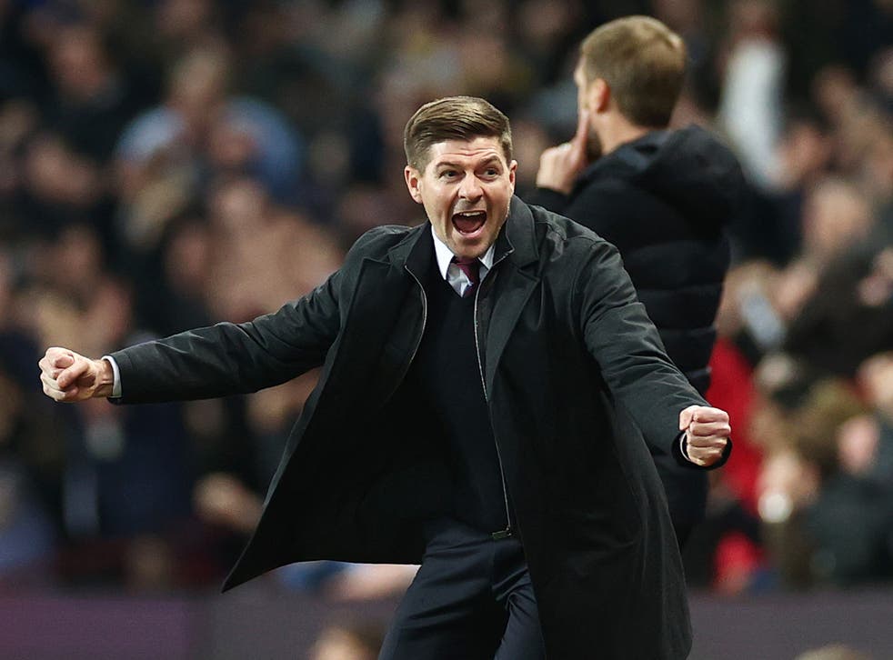 <p>Steven Gerrard celebrates after Ollie Watkins scores</p>