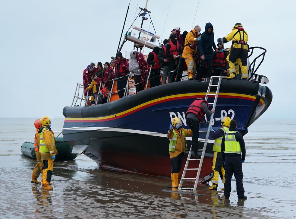 <p>A group of people thought to be migrants are brought in to Dungeness, Kent, by the RNLI following a small boat incident in the Channel. </p>