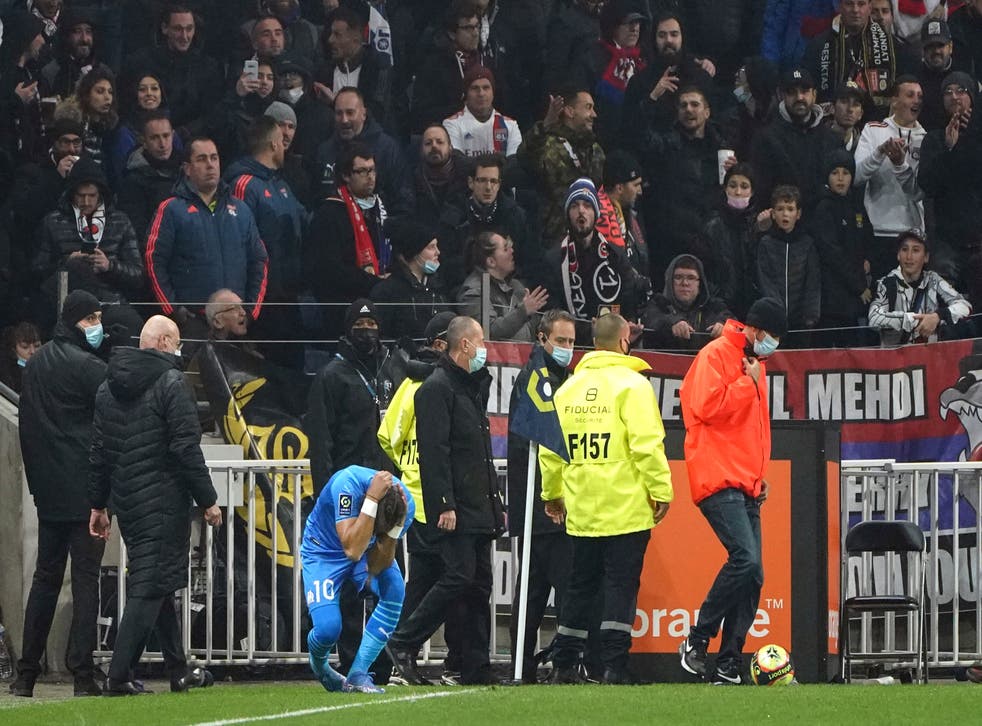Marseille’s match at Lyon was halted after Dimitri Payet was hit by a bottle thrown from the crowd (Laurent Cipriani/AP)