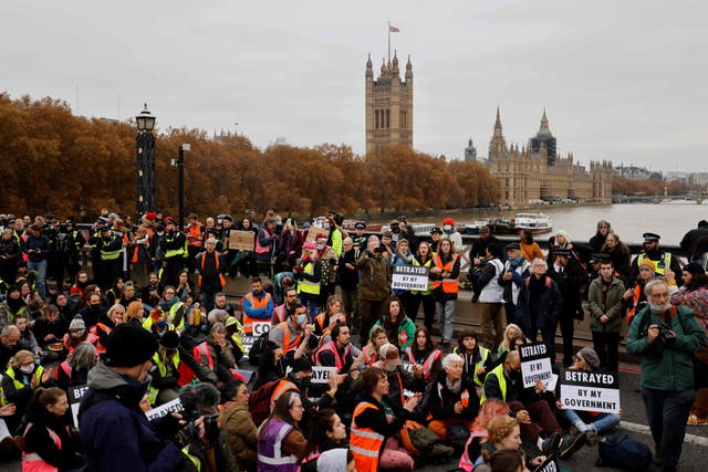 <p>Climate change activists block traffic during a protest action in solidarity with activists from the Insulate Britain group, who received prison terms for blocking roads</p>