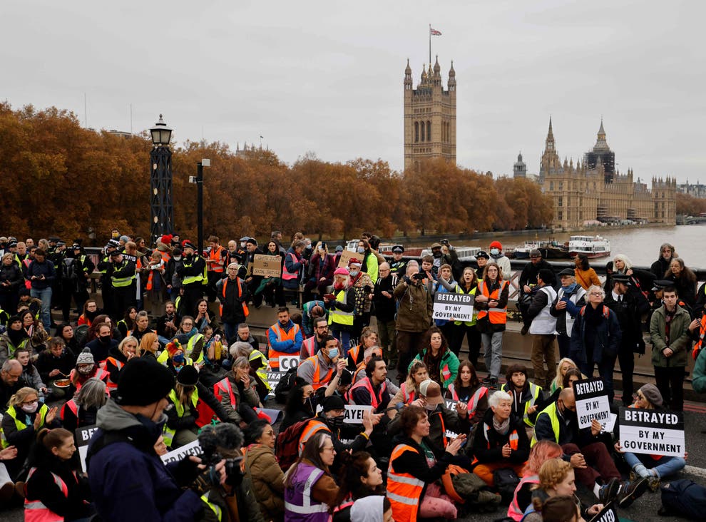 More than 120 people arrested after climate protesters block bridge in central London