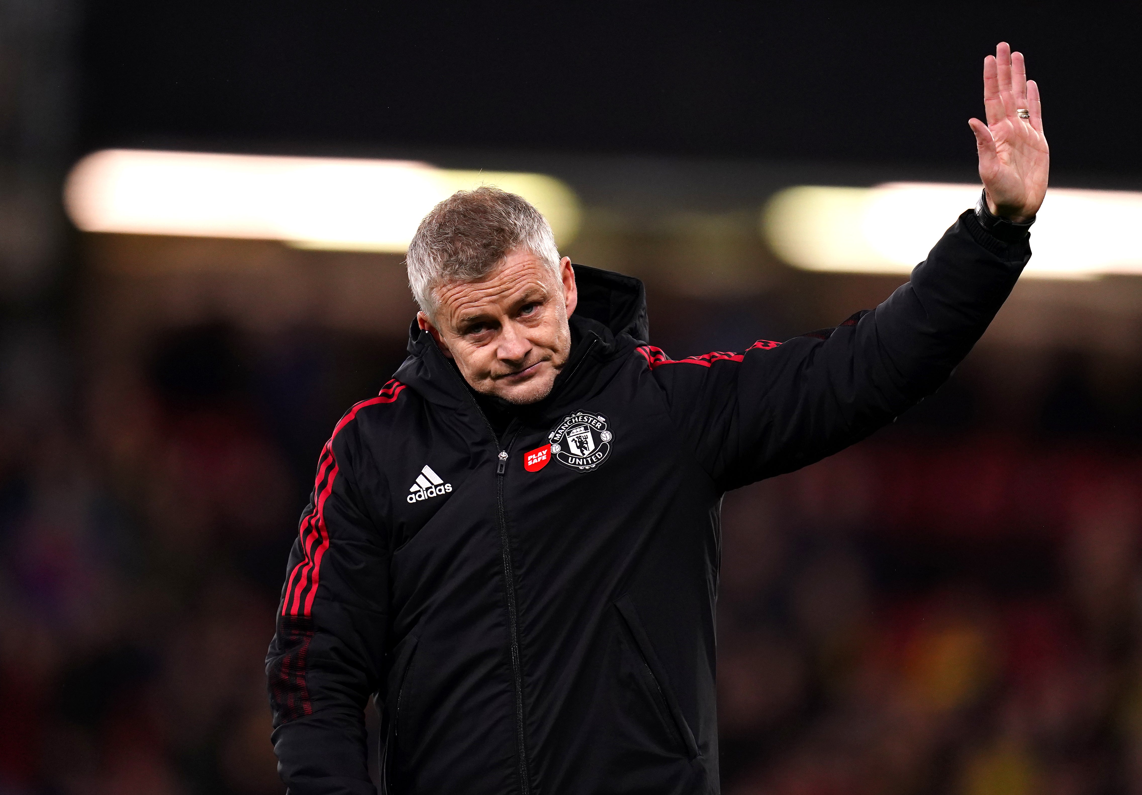 Manchester United manager Ole Gunnar Solskjaer holds up his hand in apology to the travelling supporters after the heavy defeat to Watford (John Walton/PA)