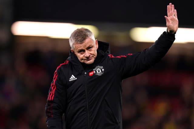 <p>Manchester United manager Ole Gunnar Solskjaer holds up his hand in apology to the travelling supporters after the heavy defeat to Watford (John Walton/PA)</p>