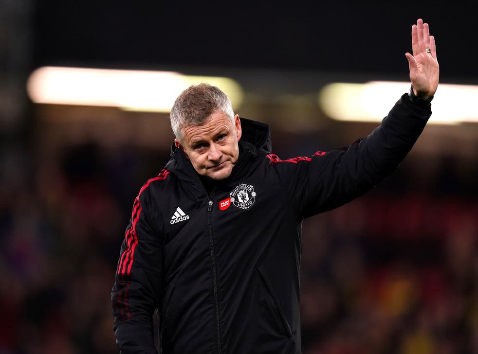 <p>Manchester United manager Ole Gunnar Solskjaer holds up his hand in apology to the travelling supporters after the heavy defeat to Watford (John Walton/PA)</p>