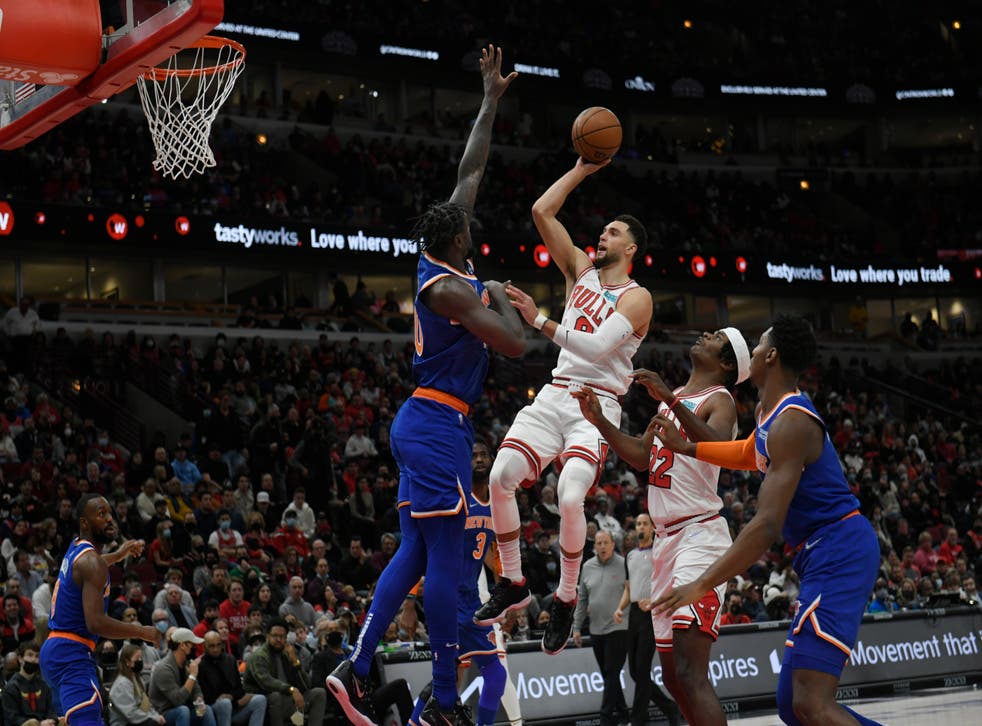 Chicago Bulls’ Zach LaVine (8) goes up for a shot against New York (Paul Beaty/AP)