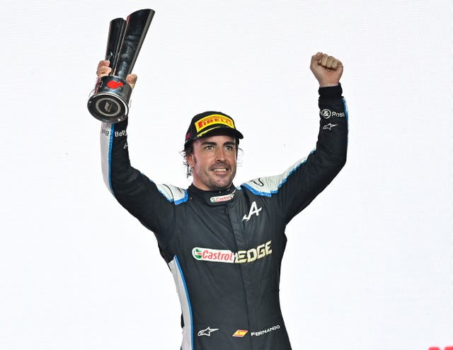 <p>Alonso was delighted after holding off a challenge from Sergio Perez to take third</p>