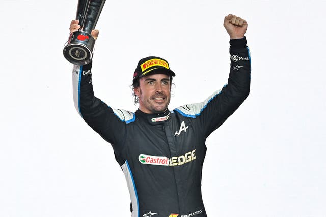 <p>Alonso was delighted after holding off a challenge from Sergio Perez to take third</p>