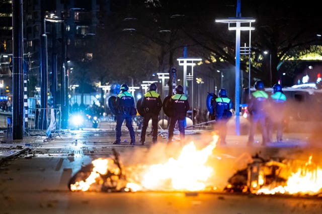 <p>Police respond to violent protests against Covid-19 restrictions in Rotterdam, the Netherlands</p>