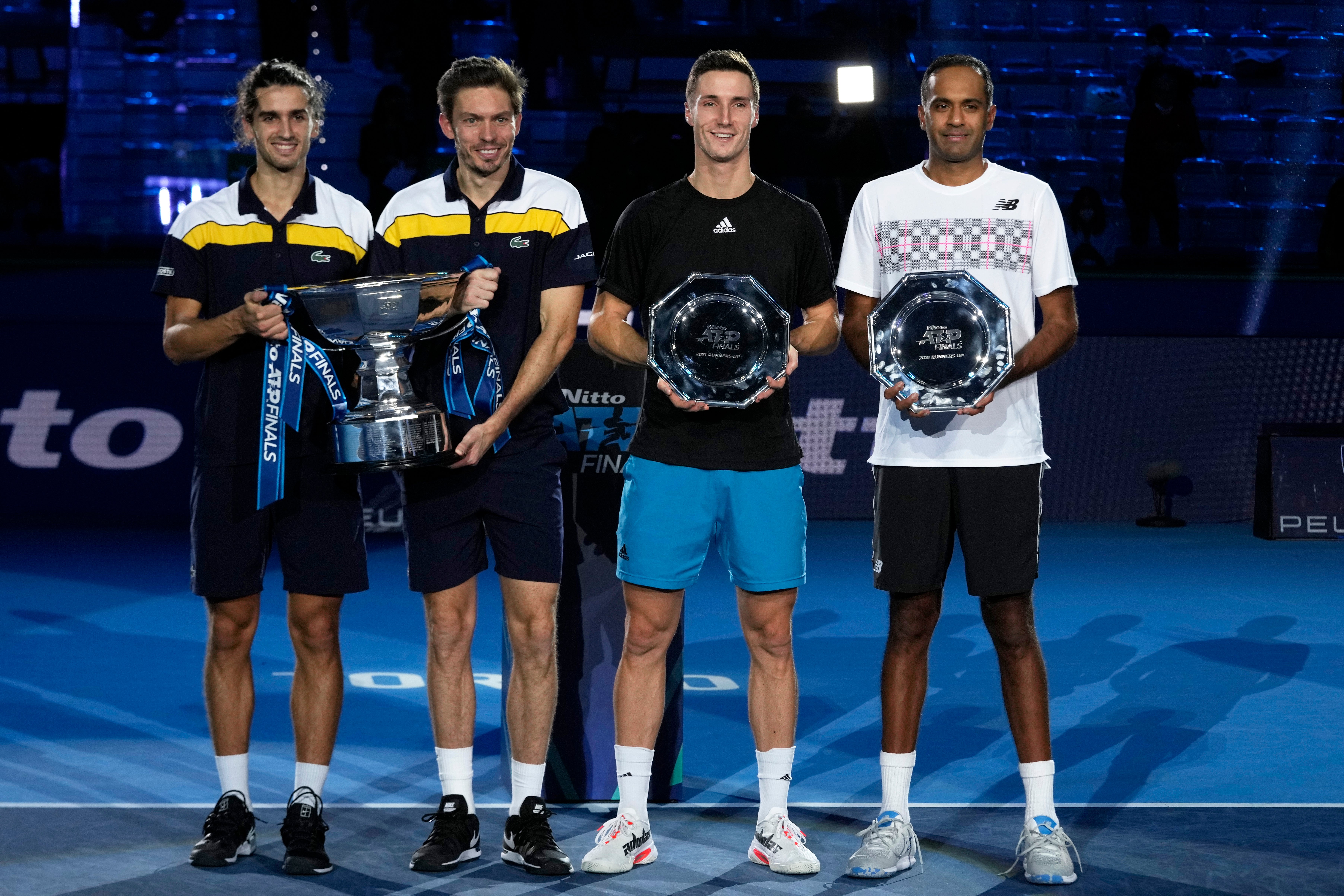Joe Salisbury, second right, was runner-up in doubles at the ATP Finals with American Rajeev Ram (Luca Bruno/AP)