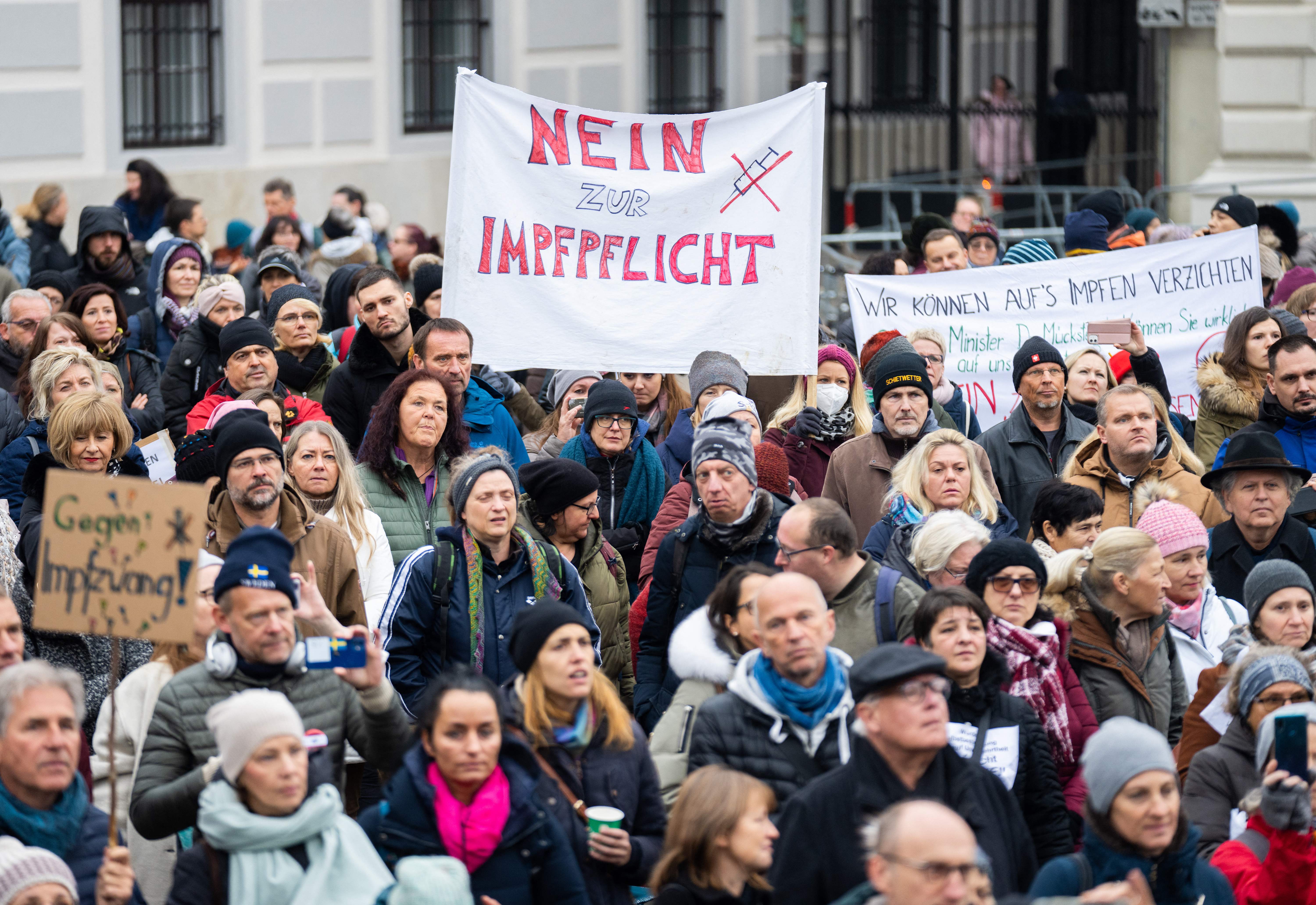 A demonstrator holds a placard reading ‘No to compulsory vaccination’ during an anti-vaccination protest in Vienna