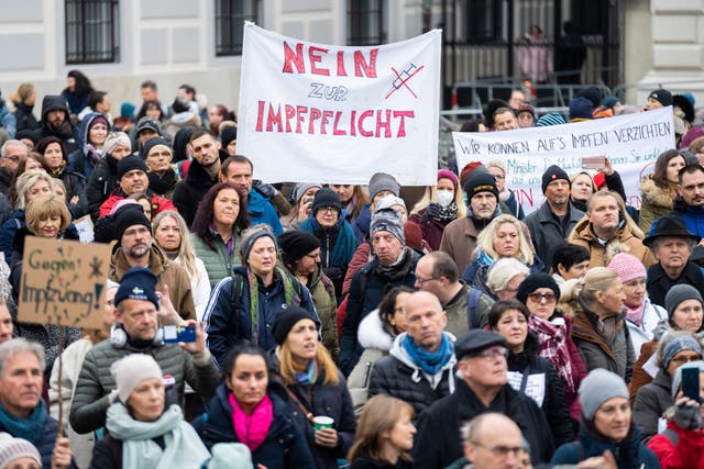 <p>A demonstrator holds a placard reading ‘No to compulsory vaccination’ during an anti-vaccination protest in Vienna</p>