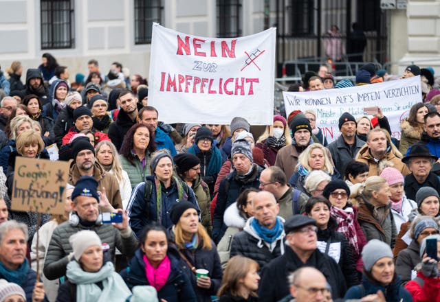 <p>A demonstrator holds a placard reading ‘No to compulsory vaccination’ during an anti-vaccination protest in Vienna</p>