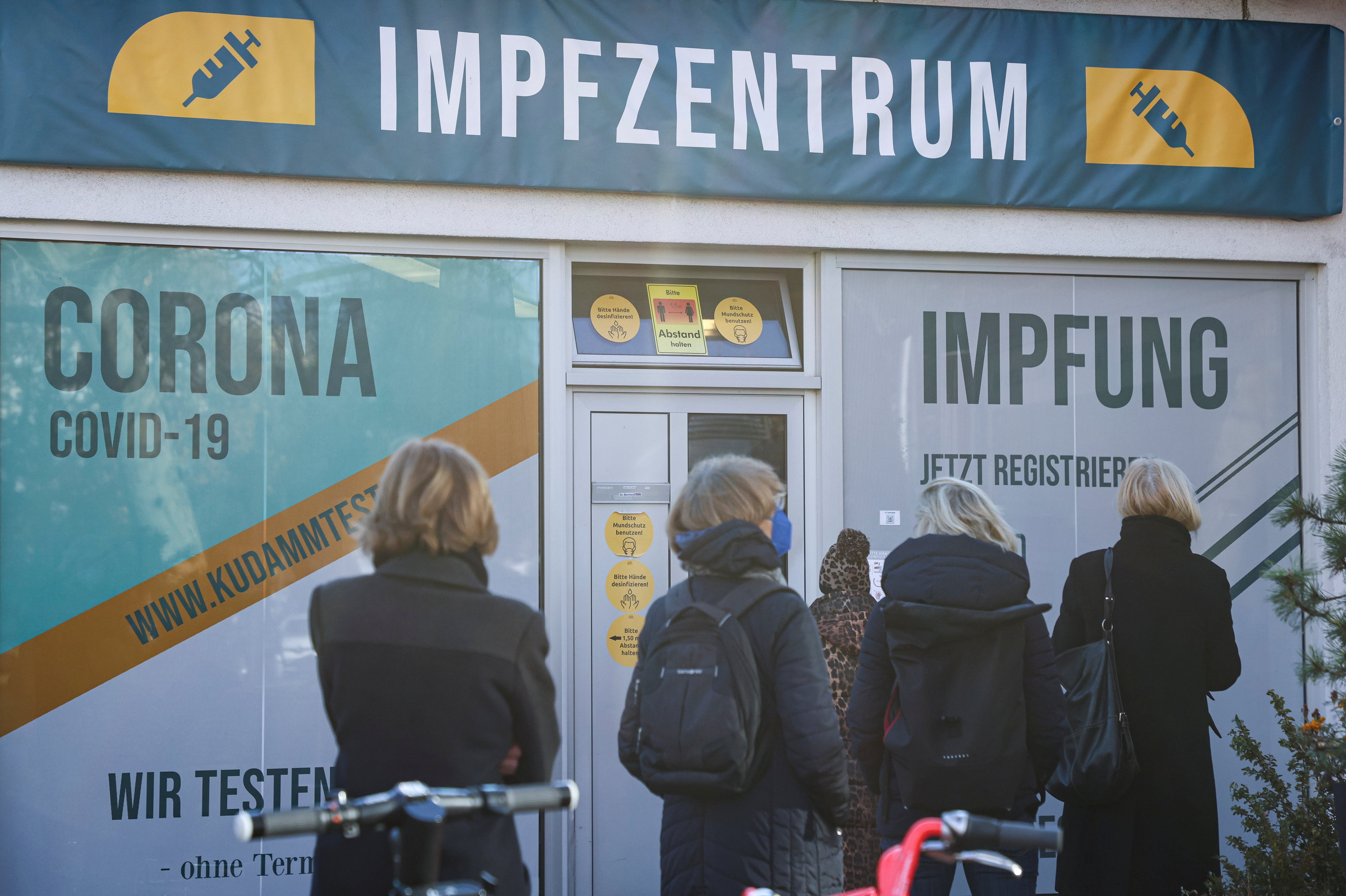 People queue outside a vaccination centre in Berlin on Monday