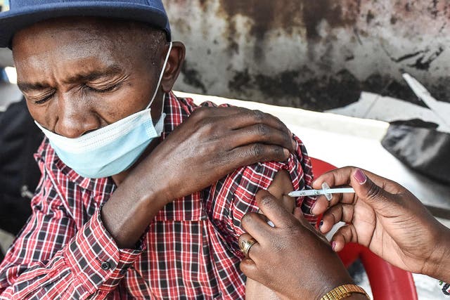 <p>A Kenyan man receives his Covid-19 vaccine in Nairobi</p>