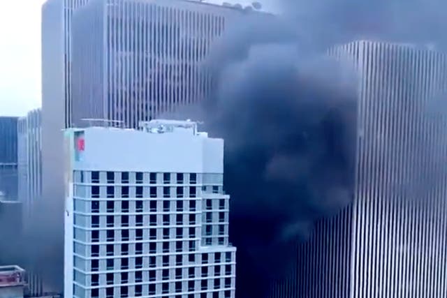 <p>Clouds of black smoke billow from a fire that broke out on the 10th floor of an under-construction hotel in Midtown Manhattan. Seven were injured in the fire. </p>