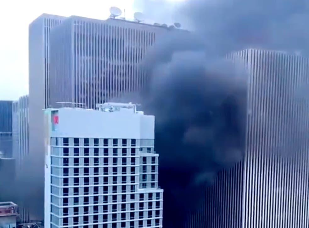 <p>Clouds of black smoke billow from a fire that broke out on the 10th floor of an under-construction hotel in Midtown Manhattan. Seven were injured in the fire. </p>