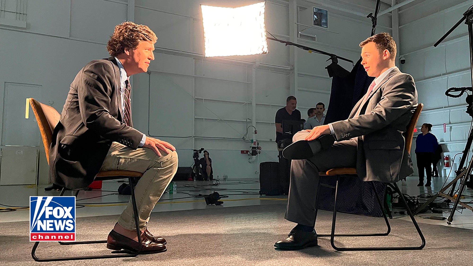 <p>In this image from an undated video, Kyle Rittenhouse, right, sits for an interview with Fox News host Tucker Carlson</p>