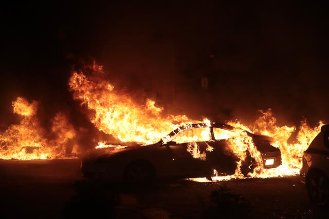 <p>Cars burn in downtown during a second night of rioting on August 24, 2020 in Kenosha, Wisconsin.</p>