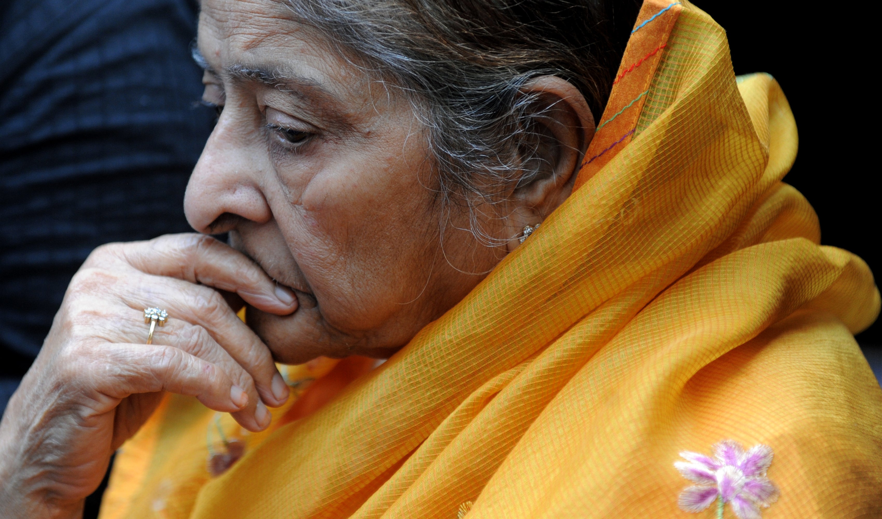 Indian widow Zakia Jafri looks on during a press interaction outside a court in Ahmedabad on 26 December 2013, following a judgement in favour of then-chief minister of Gujarat Narendra Modi over his role in the 2002 religious riots