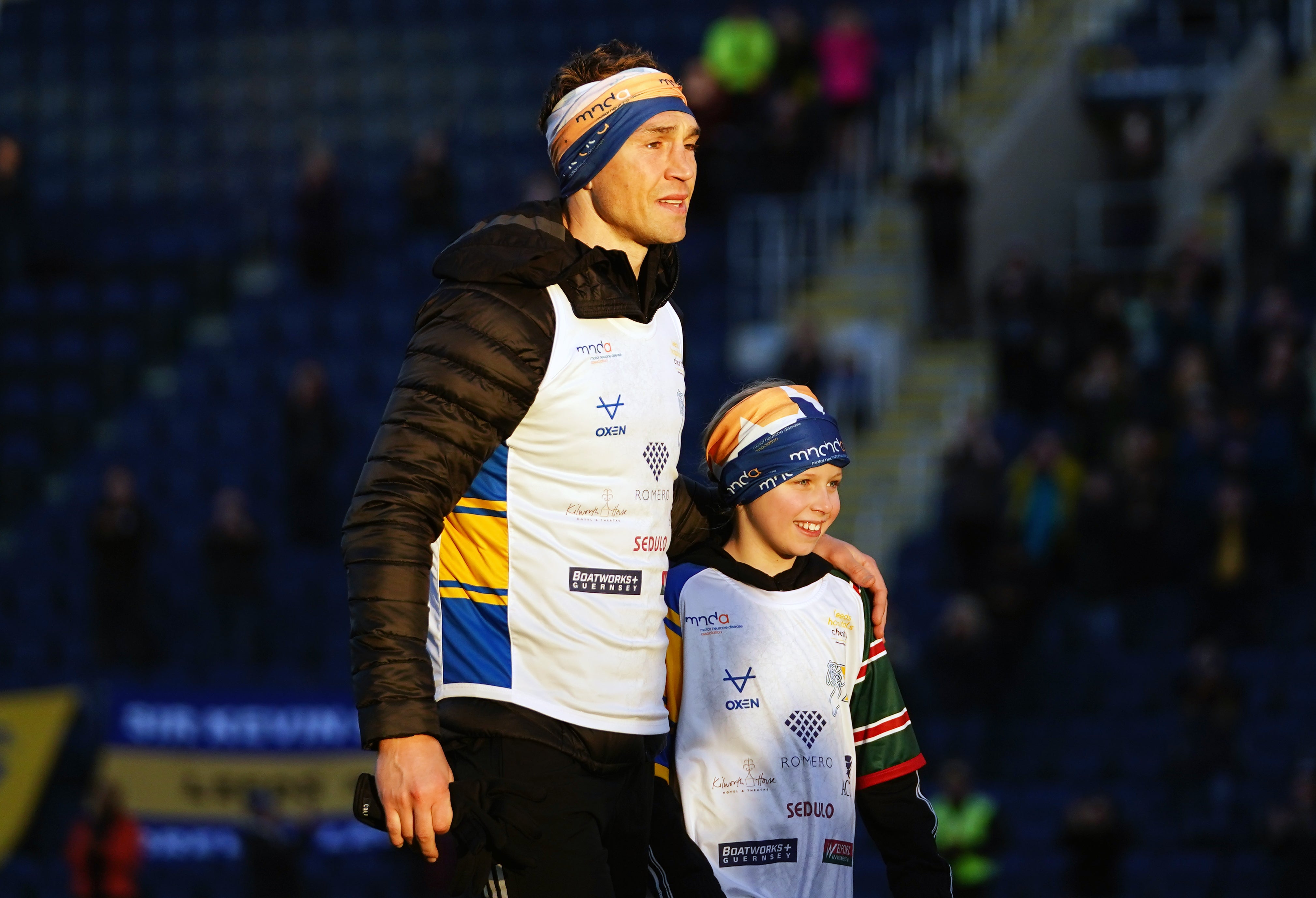 Kevin Sinfield walked into Headingley Stadum with Macy Burrow after completing the Extra Mile Challenge (Zac Goodwin/PA)