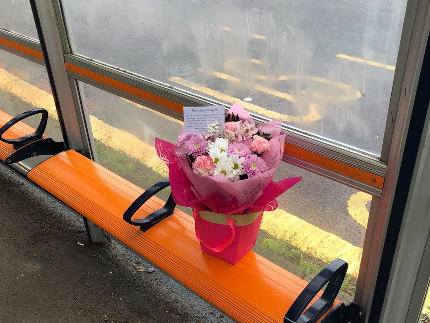 An Amanda’s Flowers bouquet left on a bus stop