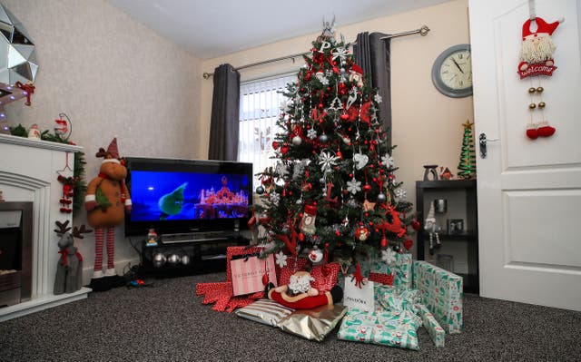 Christmas presents under tree (Peter Byrne/PA)