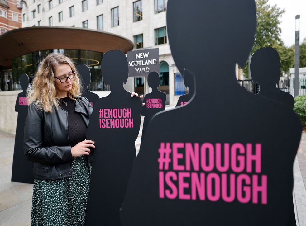<p>A campaigner outside New Scotland Yard in London on October 7, 2021, part of an action by Refuge, the domestic abuse charity</p>