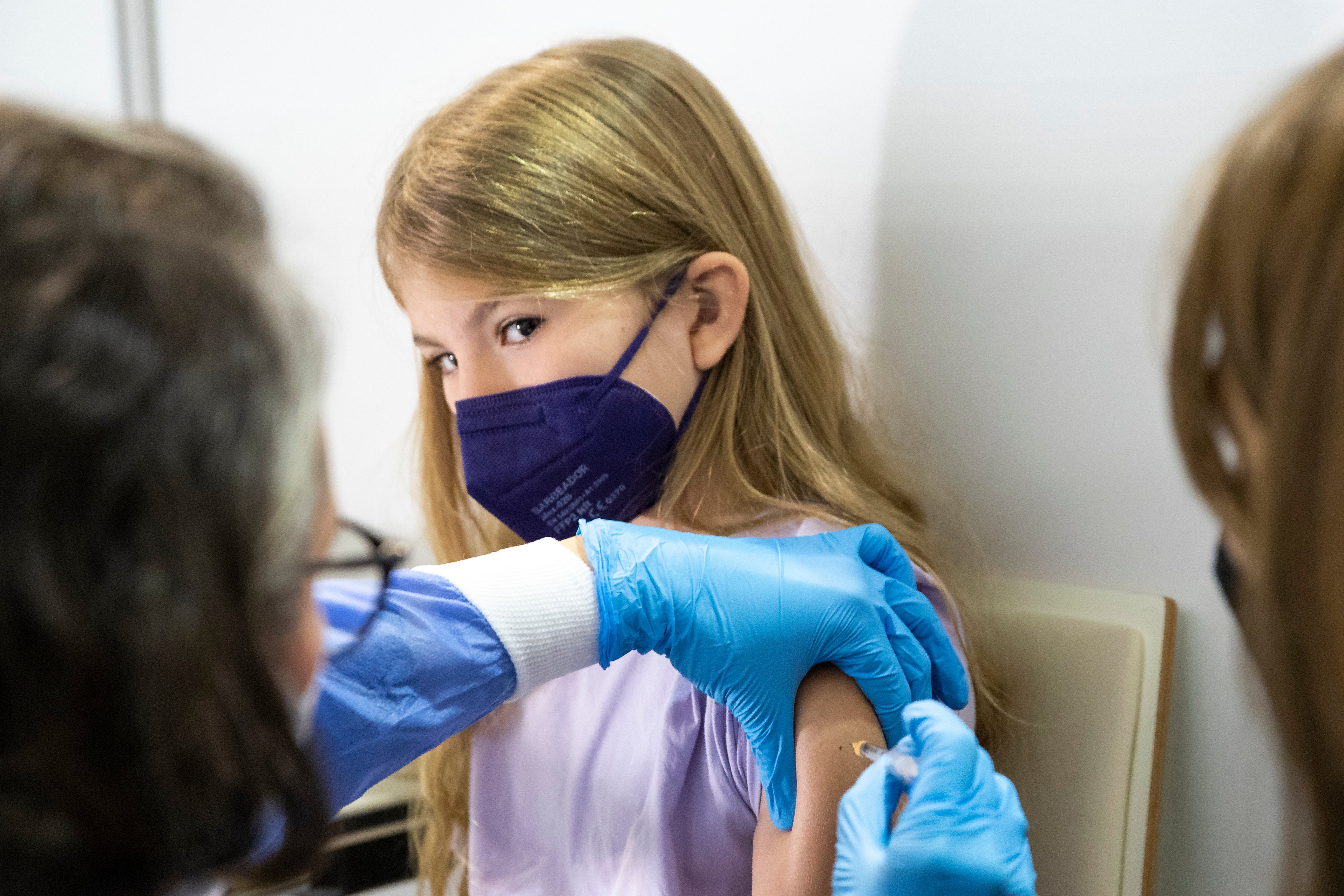 A young patient receives the Pfizer vaccine against Covid-19 in Vienna, Austria