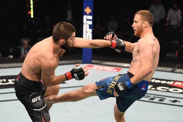 <p>Justin Gaethje kicks Khabib Nurmagomedov at UFC 254</p>