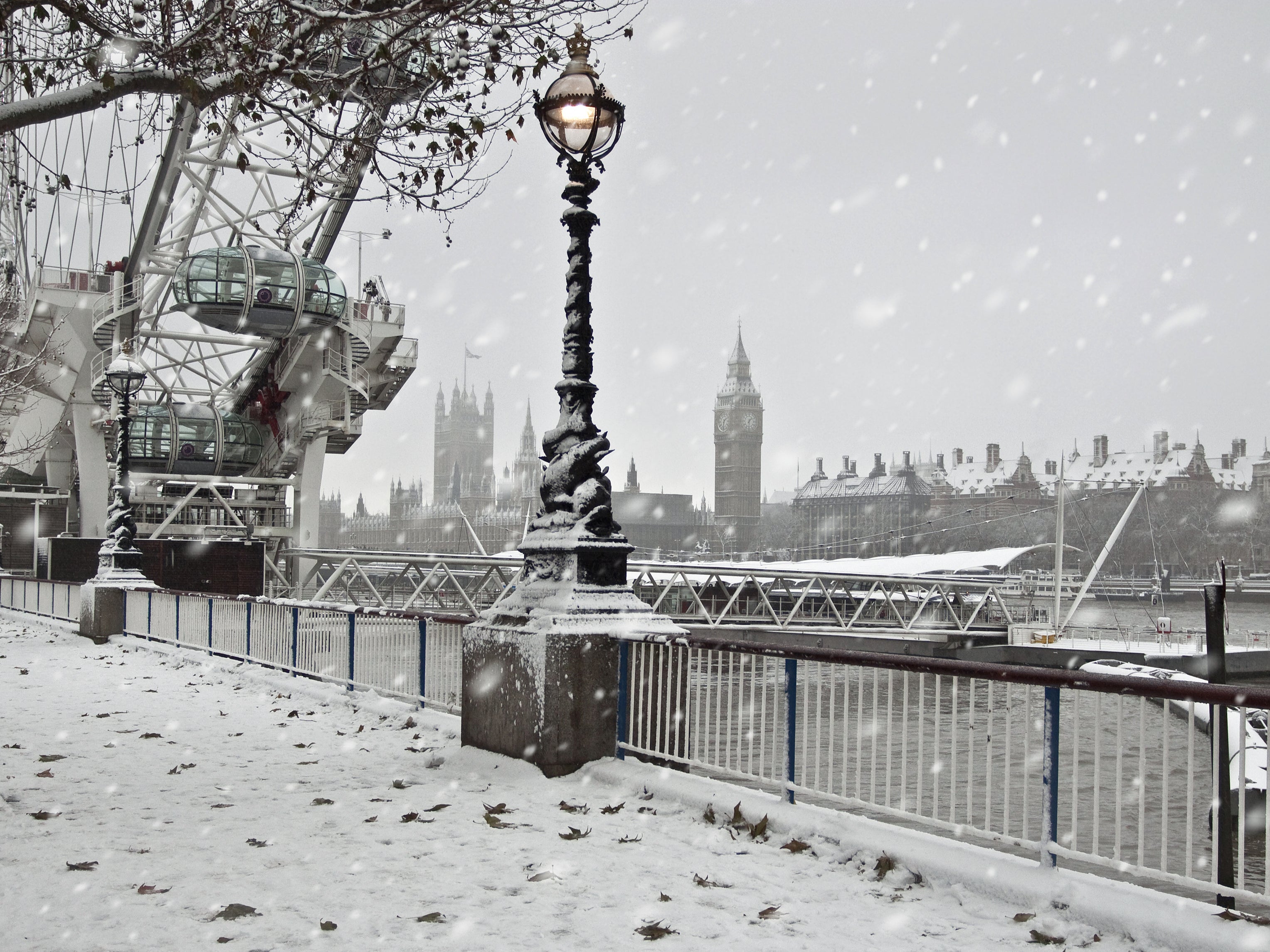 Snow falls over the South Bank of the Thames in central London