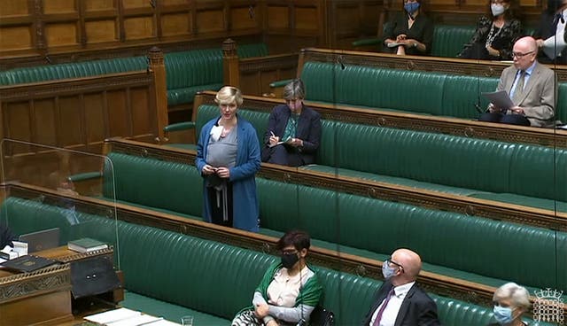 <p>Stella Creasy speaking with her newborn baby strapped to her in the chamber in September</p>