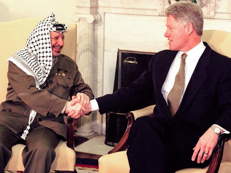 President Bill Clinton shakes hands with Yasser Arafat during a meeting at the White House in Washington, DC in 1993, prior to reaching a peace deal with the Israeli prime minister, Yitzhak Rabin