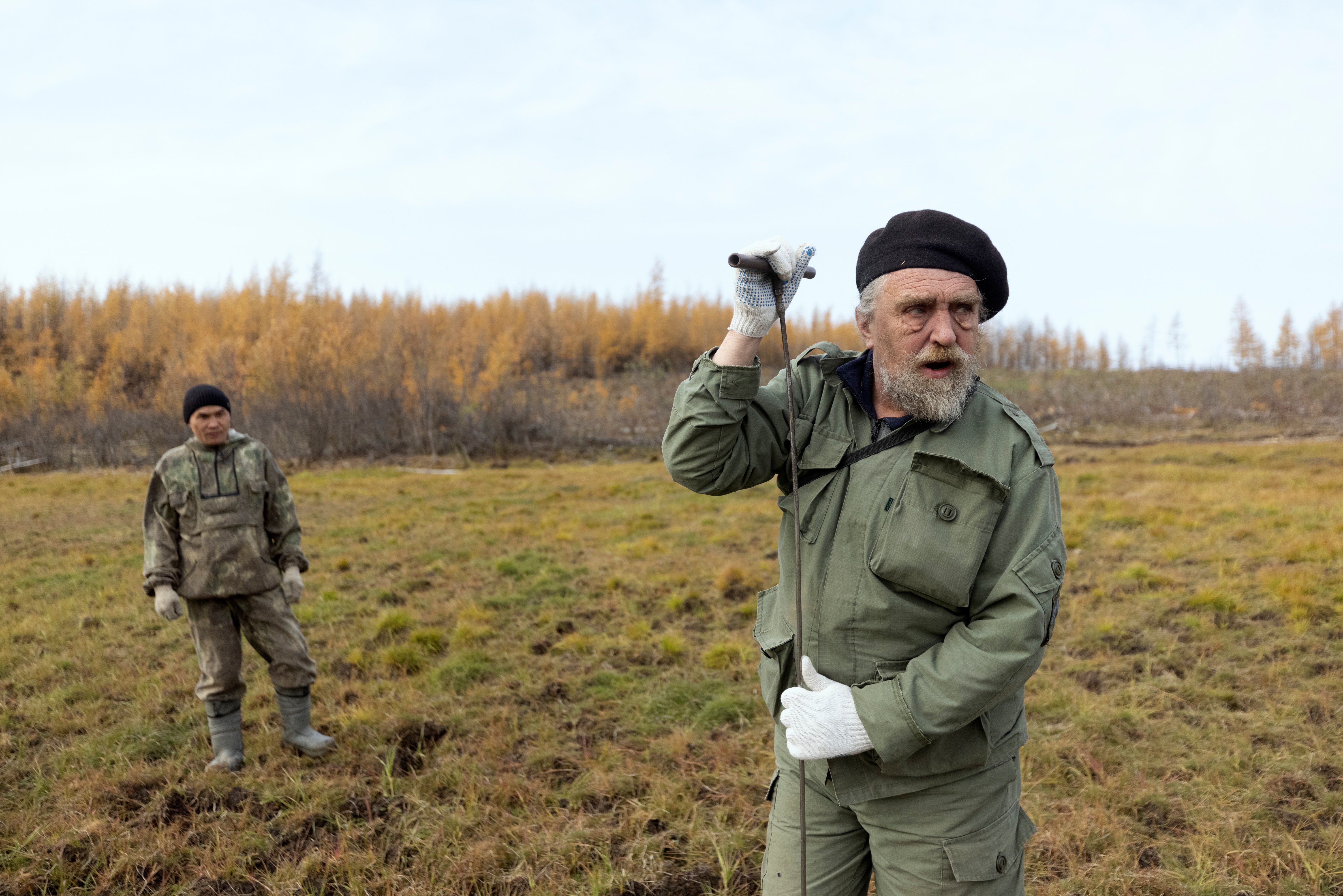 Scientist Sergey Zimov checks for permafrost at the Pleistocene Park outside the town of Chersky, Russia