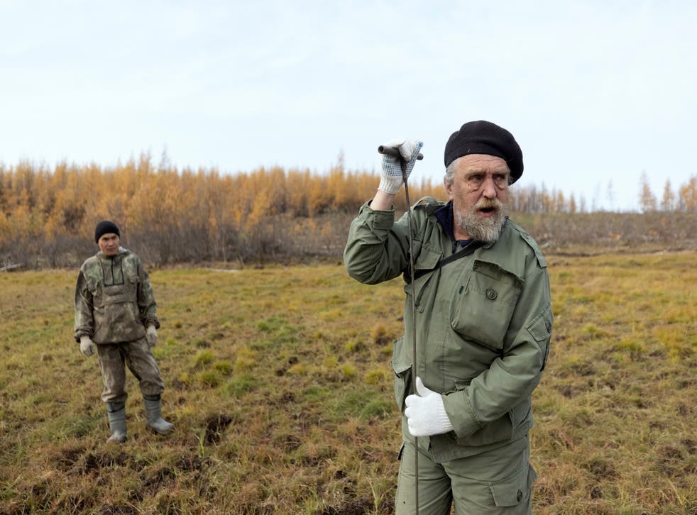 <p>Scientist Sergey Zimov checks for permafrost at the Pleistocene Park outside the town of Chersky, Russia </p>