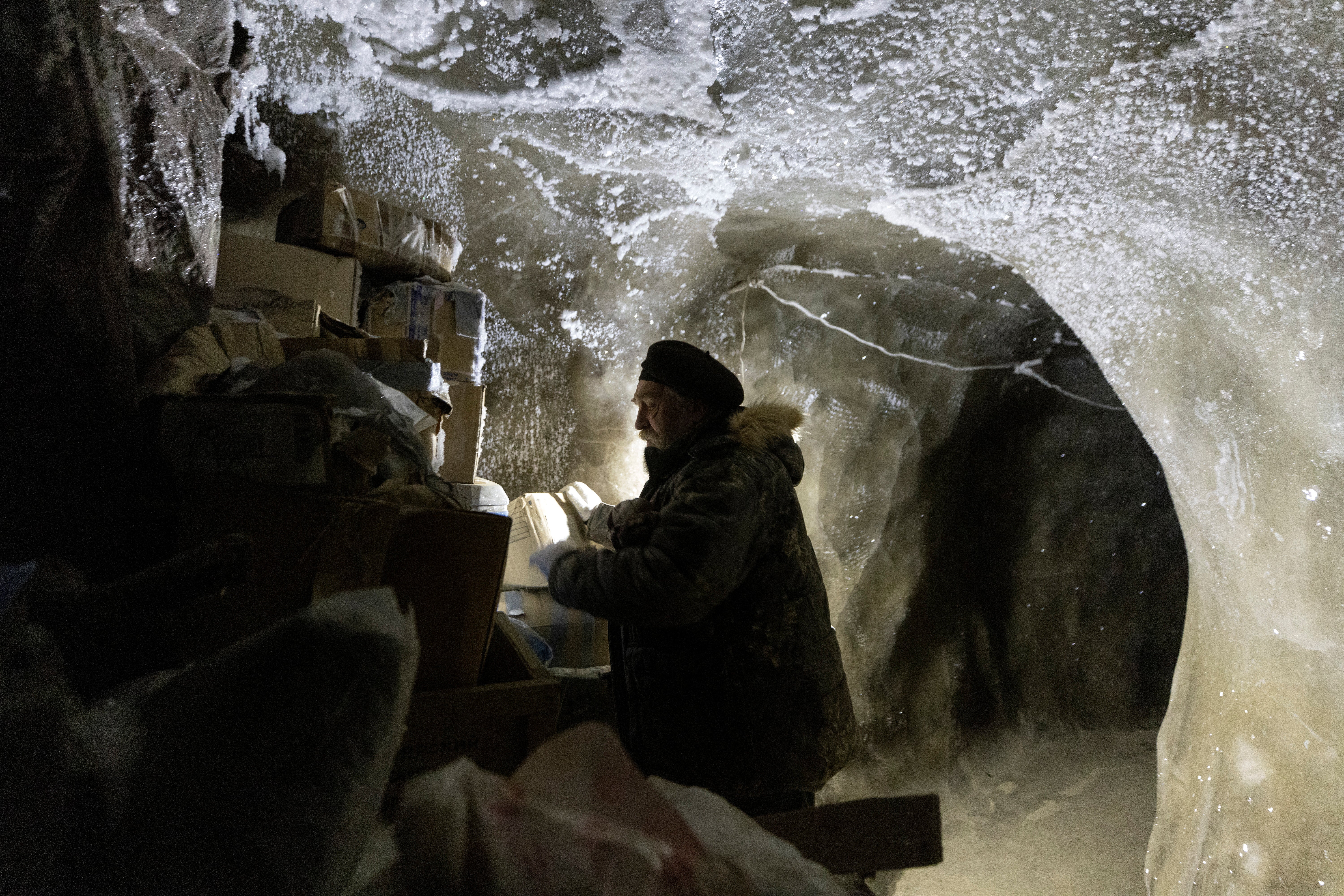 Sergey checks materials stored underground in the permafrost