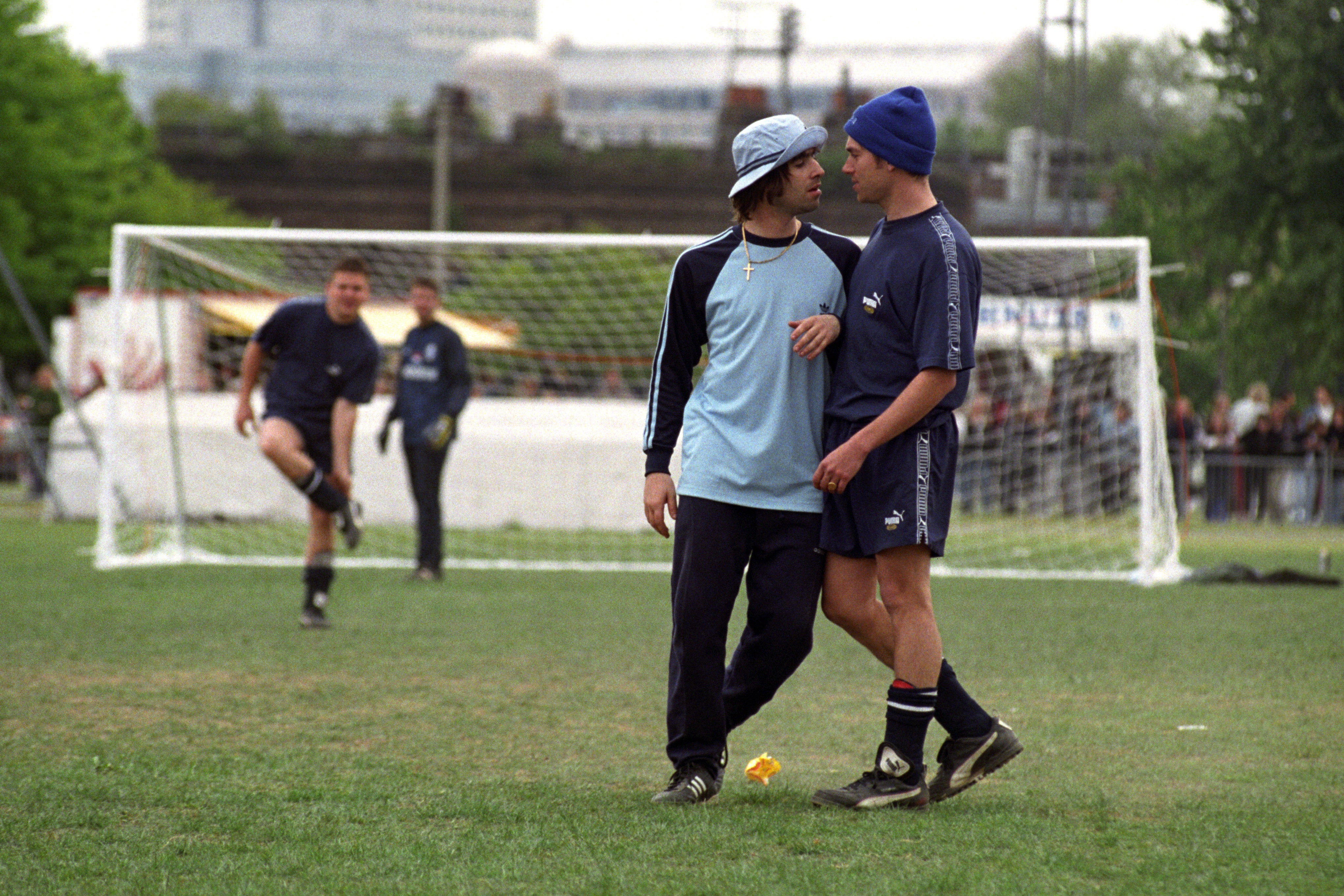 Liam Gallagher and Damon Albarn during a charity football match