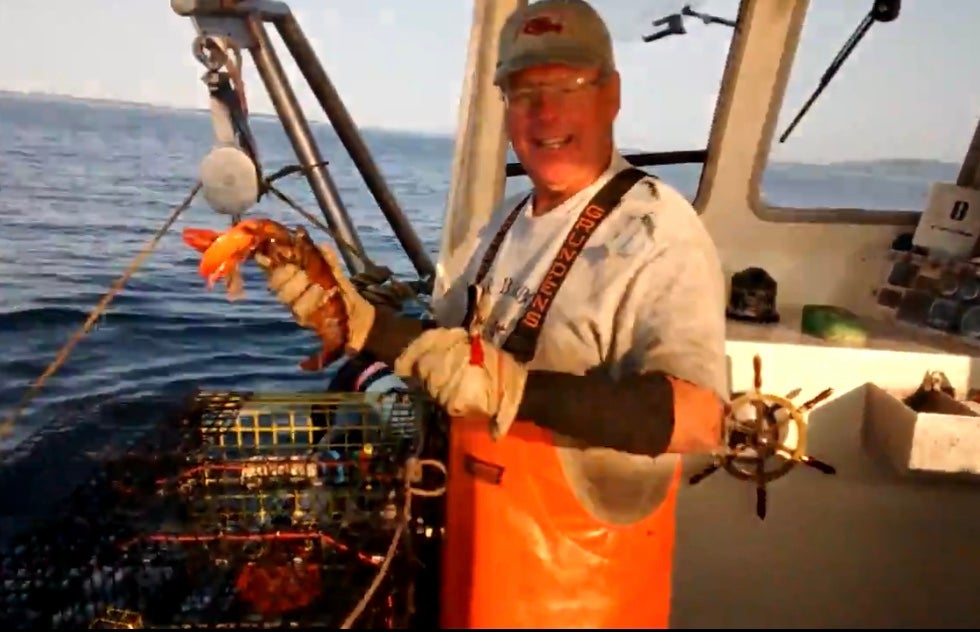 Bruce Fernald, of Cranberry Island, Maine, on his lobster fishing boat