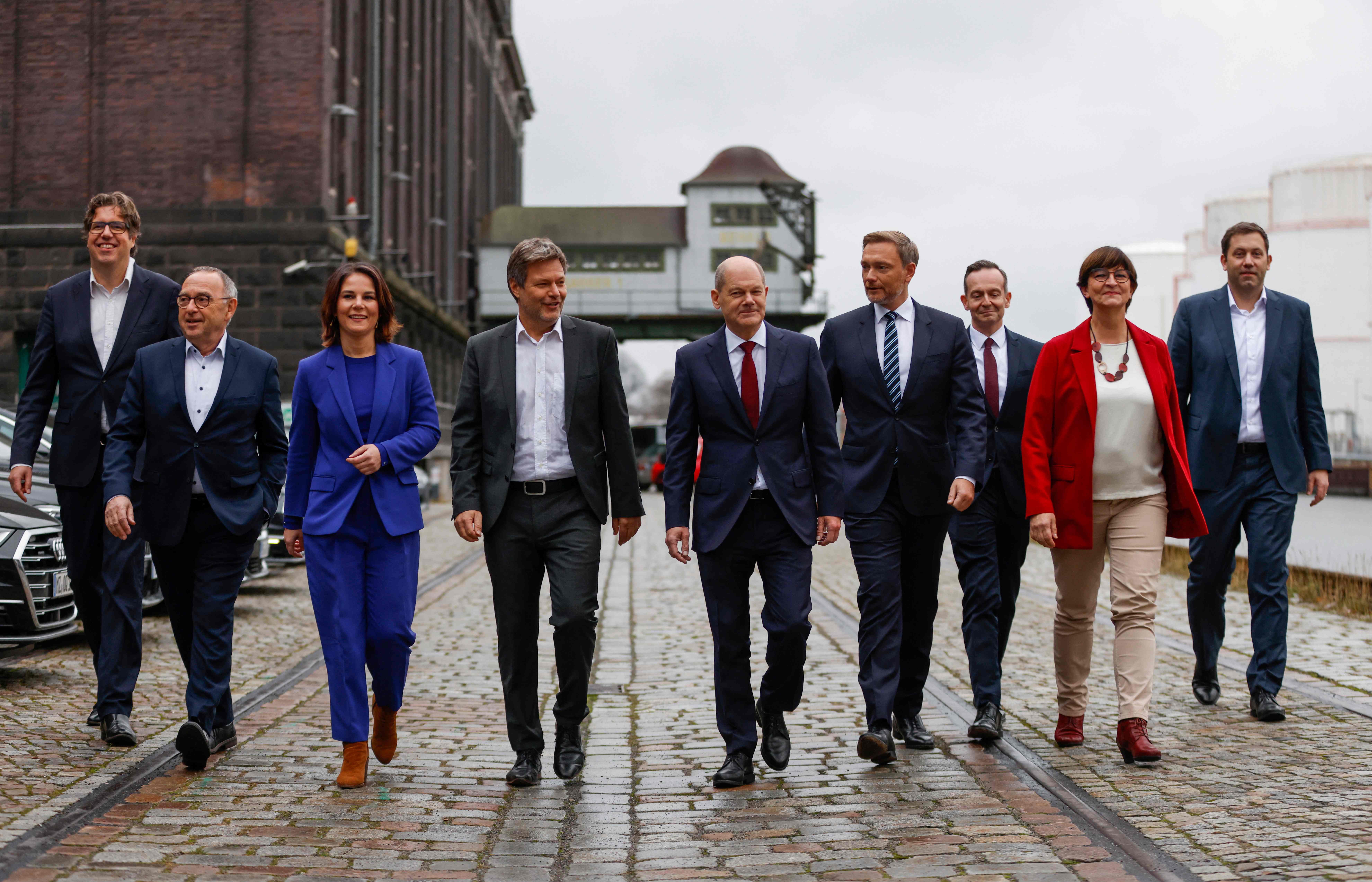 Germany’s new traffic light coalition, with the chancellor-in-waiting, Olaf Scholz (centre)
